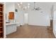 Open-concept living room features hardwood floors, a fireplace, built-in shelving and lots of light at 103 St Albans Way, Peachtree City, GA 30269