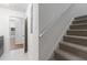 This home features a carpeted staircase that leads to the upper levels of the house at 103 St Albans Way, Peachtree City, GA 30269