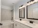Bright bathroom featuring a double sink vanity, soaking tub, and modern fixtures at 1518 Gatekeeper Ter, Marietta, GA 30066