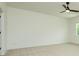 Minimalist bedroom with neutral carpet, a ceiling fan and a window providing natural light at 1518 Gatekeeper Ter, Marietta, GA 30066