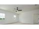 Minimalist bedroom with neutral carpet, ceiling fan, and bright window at 1518 Gatekeeper Ter, Marietta, GA 30066