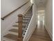 Welcoming entryway featuring hardwood floors, staircase with wood and wrought iron railing at 1518 Gatekeeper Ter, Marietta, GA 30066