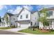 Side view of a two-story home featuring white siding, black trim and attached two car garage at 1518 Gatekeeper Ter, Marietta, GA 30066