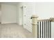 Bright hallway featuring neutral carpet, white walls, and a modern railing at 1518 Gatekeeper Ter, Marietta, GA 30066