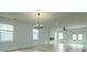 Spacious living room with hardwood floors, modern lighting, a fireplace, and lots of natural light at 1518 Gatekeeper Ter, Marietta, GA 30066