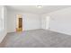 Spacious bedroom with neutral carpet, a walk-in closet, and an ensuite bathroom for convenience at 2109 Boxwood Se Cir, Conyers, GA 30094