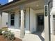 View of the cozy front porch with support beams, a window, and the house number 2109 at 2109 Boxwood Se Cir, Conyers, GA 30094
