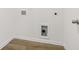 Laundry hookups in the laundry room; the room has modern flooring and white walls at 2109 Boxwood Se Cir, Conyers, GA 30094