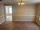 This dining room features neutral walls and carpeted floors, perfect for Gathering gatherings at 3334 Rockmill Dr, Ellenwood, GA 30294