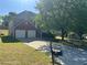 Charming two-story home boasts a two-car garage, and a well-manicured front yard at 3334 Rockmill Dr, Ellenwood, GA 30294