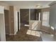 This kitchen offers ample natural light and views into the adjacent dining room at 3334 Rockmill Dr, Ellenwood, GA 30294