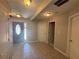 Inviting foyer features tile flooring and a decorative glass accent on the front door at 1365 Jubilee Ln, Mcdonough, GA 30253