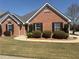 Charming one-story brick home with well-maintained lawn and manicured landscaping at 1365 Jubilee Ln, Mcdonough, GA 30253