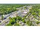 Overhead perspective showing the neighborhood's layout, shopping centers, and tree-lined streets at 218 Midvale Ne Dr, Atlanta, GA 30342
