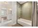 Modern bathroom with a tiled shower and a soaking tub at 218 Midvale Ne Dr, Atlanta, GA 30342