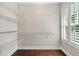 Walk-in closet with custom wire shelving and natural light at 218 Midvale Ne Dr, Atlanta, GA 30342