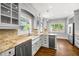 Bright kitchen featuring stainless appliances, granite countertops, and a farmhouse sink at 218 Midvale Ne Dr, Atlanta, GA 30342