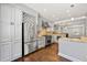 Spacious kitchen with stainless steel appliances, granite countertops, and a wine rack at 218 Midvale Ne Dr, Atlanta, GA 30342