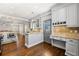Open kitchen with island seating and stainless steel appliances at 218 Midvale Ne Dr, Atlanta, GA 30342