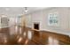 Bright living room featuring hardwood floors, a fireplace, plantation shutters, and an open layout at 218 Midvale Ne Dr, Atlanta, GA 30342