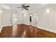 Cozy living room with hardwood floors, ceiling fan, and lots of natural light at 218 Midvale Ne Dr, Atlanta, GA 30342