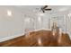 Open-concept living room with hardwood floors and glass-paneled doors at 218 Midvale Ne Dr, Atlanta, GA 30342