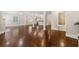 Open-concept living area showcasing gleaming hardwood floors, neutral paint, and seamless flow into other spaces at 218 Midvale Ne Dr, Atlanta, GA 30342