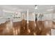 Expansive living space featuring hardwood floors, architectural columns, and an open flow into the kitchen at 218 Midvale Ne Dr, Atlanta, GA 30342
