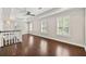 Open loft area with hardwood floors, natural light, and a ceiling fan at 218 Midvale Ne Dr, Atlanta, GA 30342