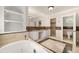 A bathtub and vanity highlight this primary bathroom's features at 218 Midvale Ne Dr, Atlanta, GA 30342