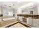 Luxurious bathroom featuring a tub, double vanity and neutral tile flooring at 218 Midvale Ne Dr, Atlanta, GA 30342