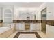Main bathroom with double sink vanity, tub and marble countertops at 218 Midvale Ne Dr, Atlanta, GA 30342