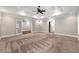 Large main bedroom with carpet flooring and glass paneled doors leading to another room at 218 Midvale Ne Dr, Atlanta, GA 30342