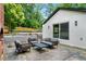 Backyard patio area with outdoor seating and a brick outdoor fireplace that enhances outdoor living at 3154 N Druid Hills Rd, Decatur, GA 30033