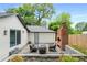 Backyard patio area with outdoor seating and a brick outdoor fireplace that enhances outdoor living at 3154 N Druid Hills Rd, Decatur, GA 30033