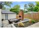 Backyard patio area with outdoor seating and a brick outdoor fireplace that enhances outdoor living at 3154 N Druid Hills Rd, Decatur, GA 30033