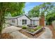 Backyard patio area with outdoor seating, a garden area, and walkway that enhances outdoor living at 3154 N Druid Hills Rd, Decatur, GA 30033