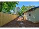 Spacious backyard area with privacy fence, stepping stones, and manicured landscaping at 3154 N Druid Hills Rd, Decatur, GA 30033