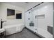 Modern bathroom with frameless glass shower and white tile walls at 3154 N Druid Hills Rd, Decatur, GA 30033
