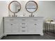 Bathroom with marble countertops and double round mirrors at 3154 N Druid Hills Rd, Decatur, GA 30033