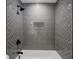 Modern bathroom featuring herringbone tile, sleek fixtures, and a convenient built-in niche at 3154 N Druid Hills Rd, Decatur, GA 30033