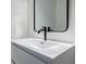Modern bathroom featuring a sleek sink, black fixtures, and a minimalist design at 3154 N Druid Hills Rd, Decatur, GA 30033