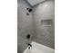 Modern bathroom featuring herringbone tile, sleek fixtures, and a convenient built-in niche at 3154 N Druid Hills Rd, Decatur, GA 30033