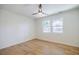 Bright, empty bedroom with hardwood floors and two windows providing natural light at 3154 N Druid Hills Rd, Decatur, GA 30033