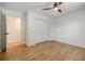 Bright bedroom with hardwood floors, closet, and a ceiling fan at 3154 N Druid Hills Rd, Decatur, GA 30033