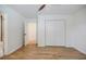 Bright bedroom featuring hardwood floors, closet, and a ceiling fan at 3154 N Druid Hills Rd, Decatur, GA 30033
