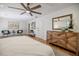 Bedroom with hardwood floors, ceiling fan, dresser, and lounge area at 3154 N Druid Hills Rd, Decatur, GA 30033