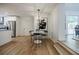 The dining area features a modern light fixture and adjacent access to the kitchen with stainless appliances at 3154 N Druid Hills Rd, Decatur, GA 30033