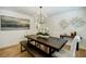 Dining room showcasing a dark wood table, bench seating, and a modern chandelier at 3154 N Druid Hills Rd, Decatur, GA 30033