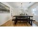 Dining room featuring a modern chandelier, hardwood floors, and stylish decor at 3154 N Druid Hills Rd, Decatur, GA 30033
